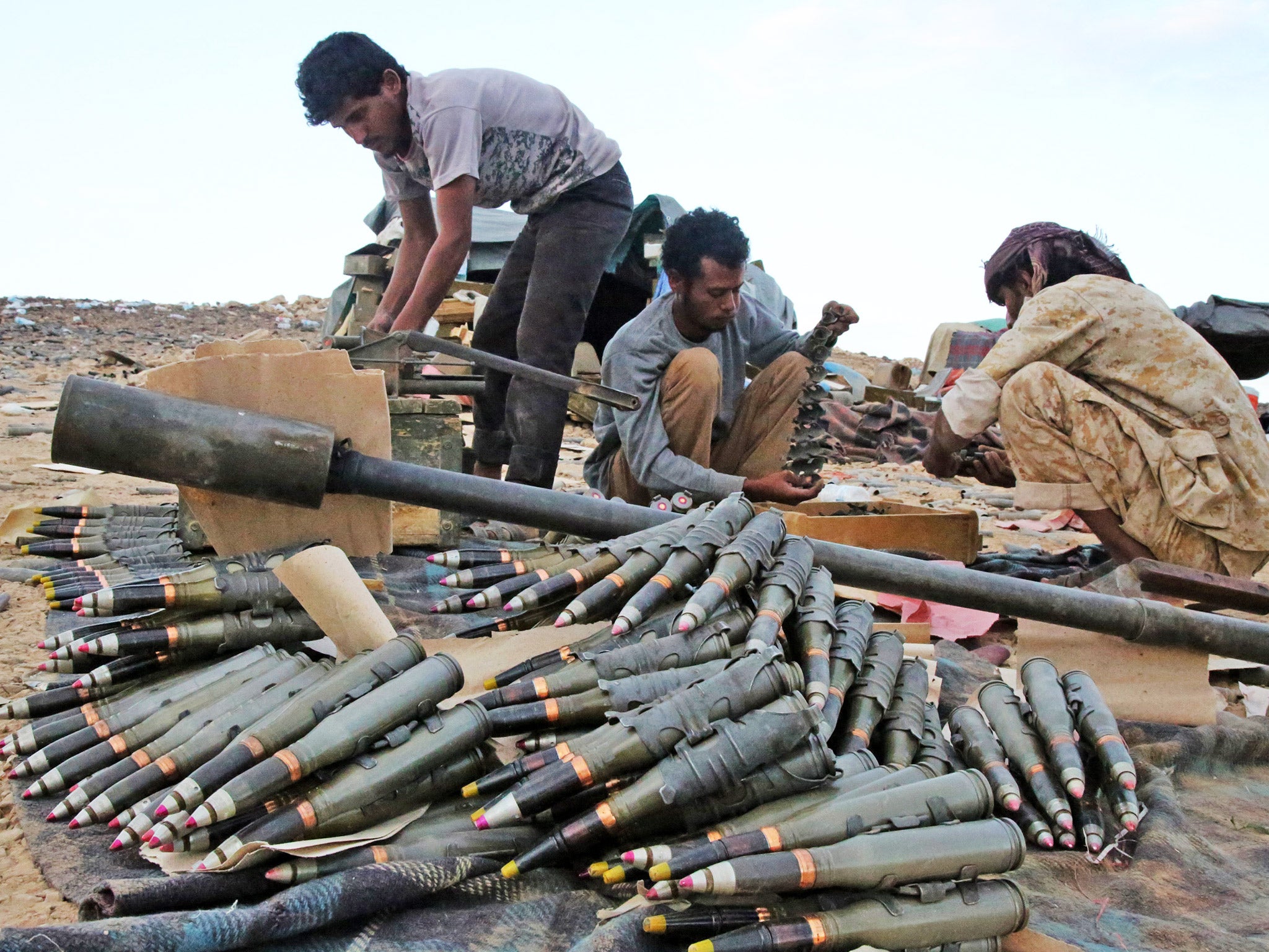 Supporting forces loyal to Yemen's Saudi-backed President Abedrabbo Mansour Hadi, prepare and review ammunition in the area of Sirwa