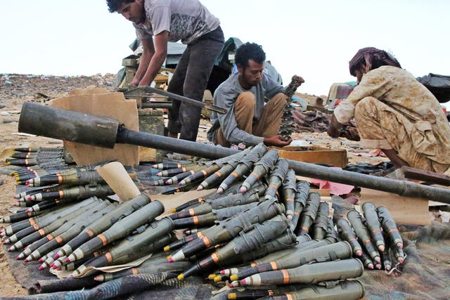 Supporting forces loyal to Yemen's Saudi-backed President Abedrabbo Mansour Hadi, prepare and review ammunition in the area of Sirwa