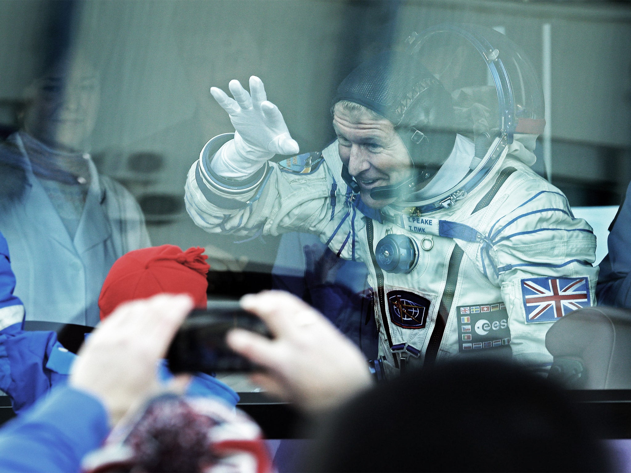 British astronaut Tim Peake waves to his sons shortly before lift-off