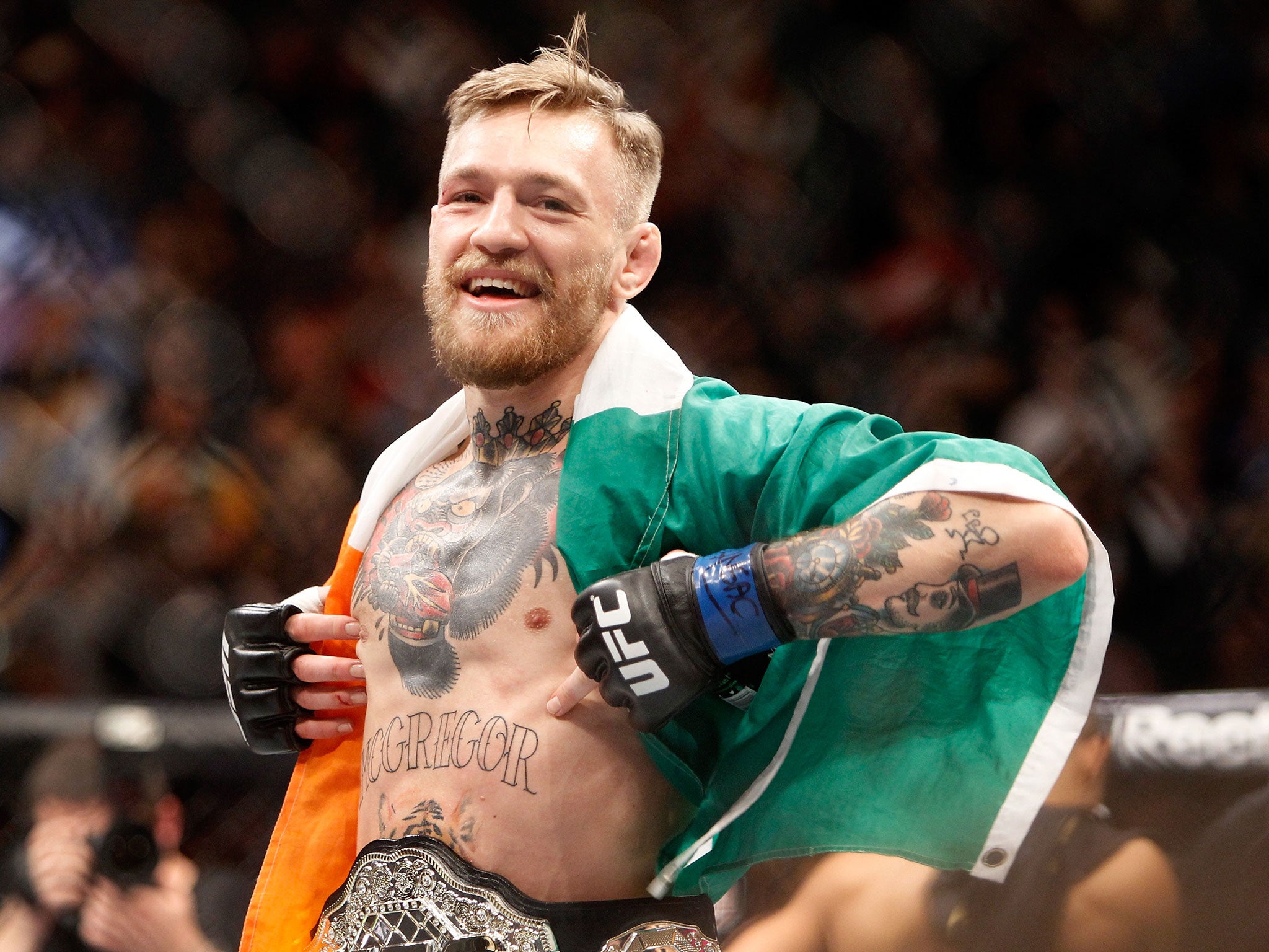 Conor McGregor celebrates his UFC 194 victory over Jose Aldo