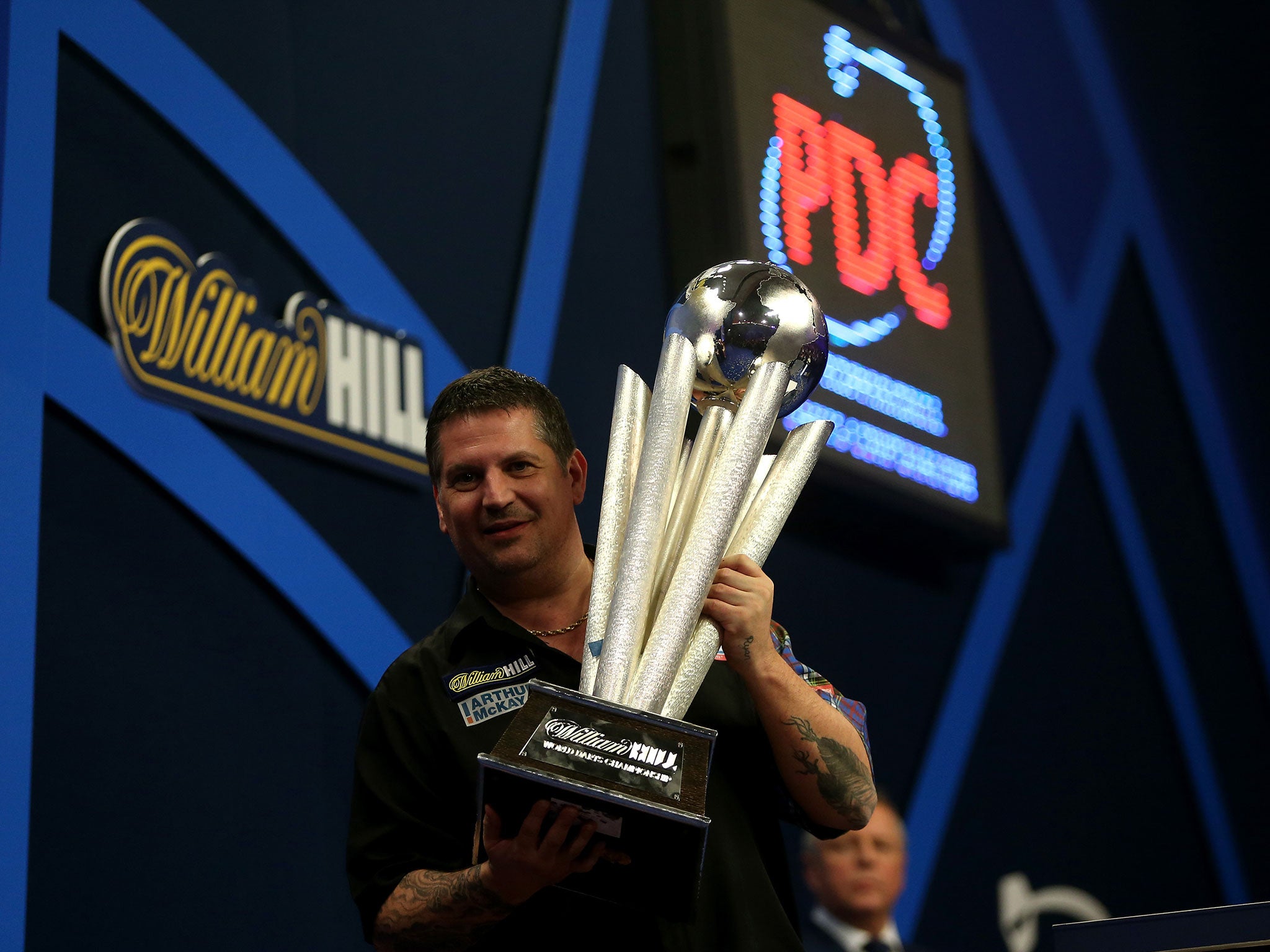 Gary Anderson celebrates after winning the 2015 Darts World Championship