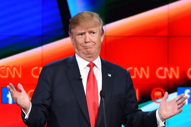Republican presidential candidate businessman Donald Trump gestures during the Republican Presidential Debate, hosted by CNN, at The Venetian Las Vegas