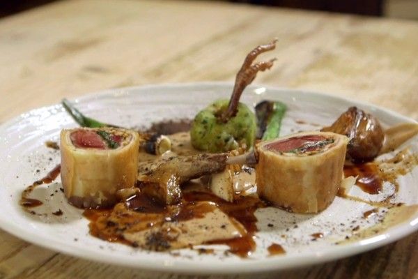 
Pigeon Wellington garnished with a pigeon's foot 