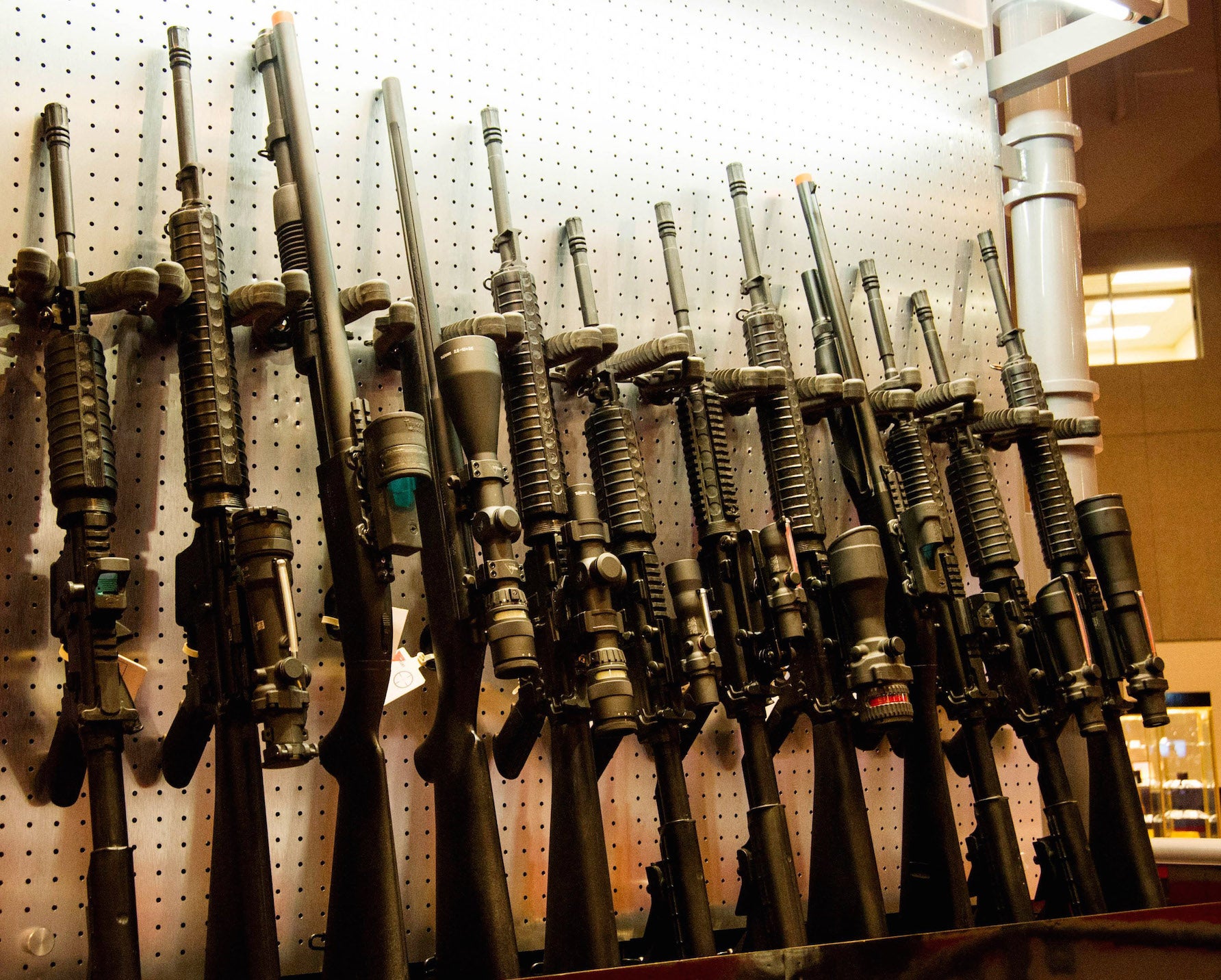 A wall of semi-automatic rifles at the National Rifle Association Annual Meetings and Exhibits in St. Louis, Missouri.