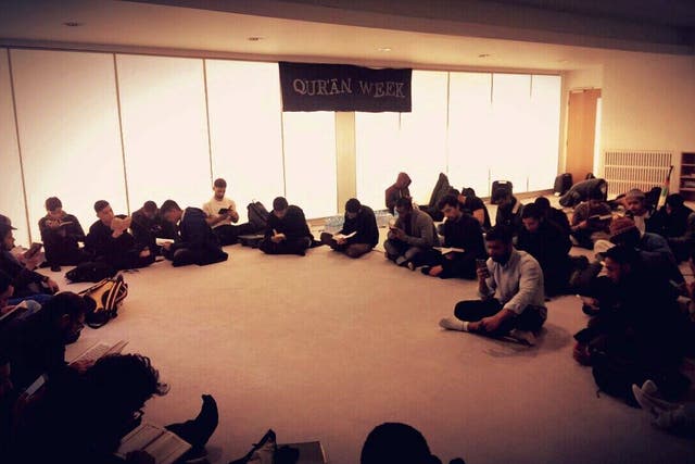 The society, pictured, observing a Qur'an Week in March