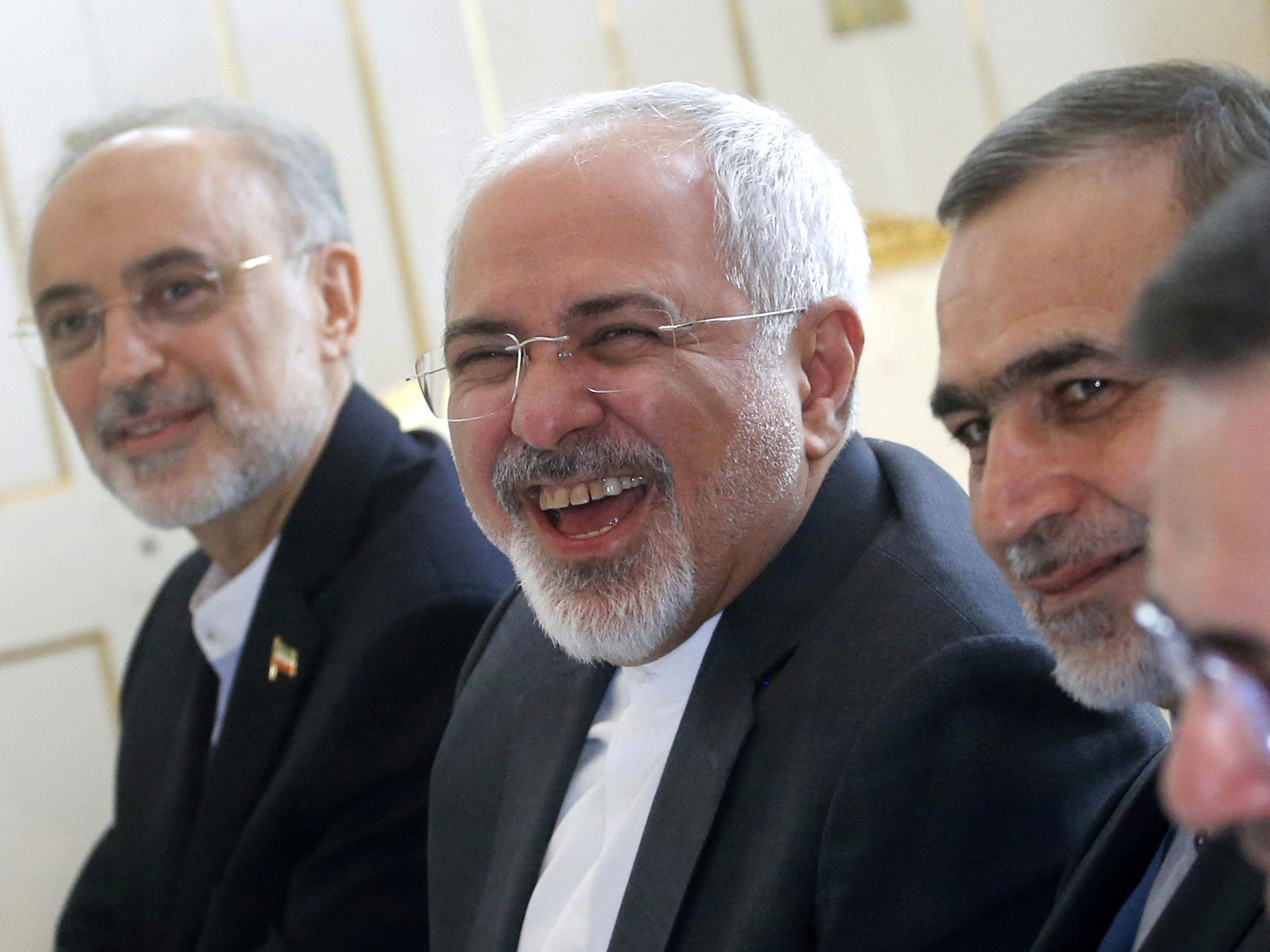 Zarif laughs during a meeting in Vienna