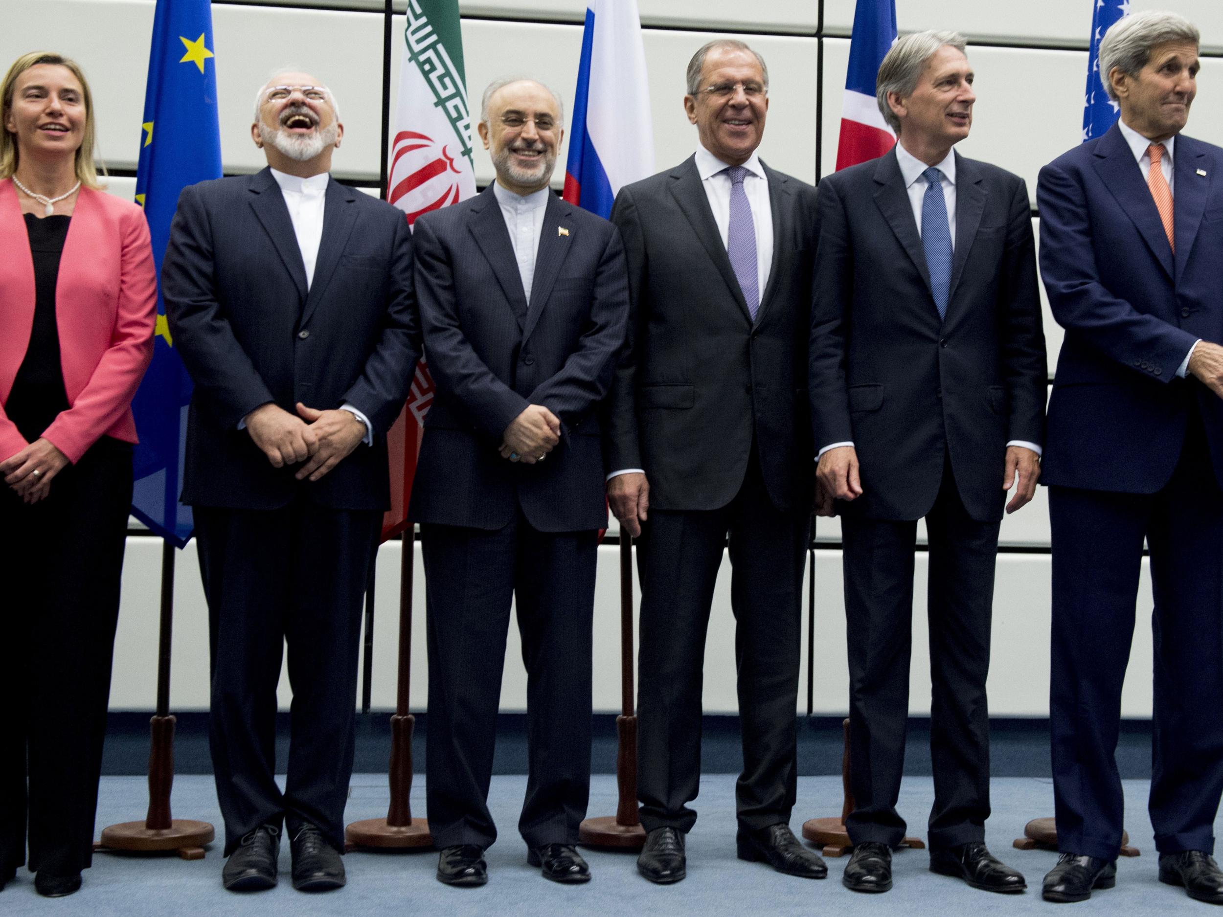 Zarif laughs during group photo at UN meeting in Vienna