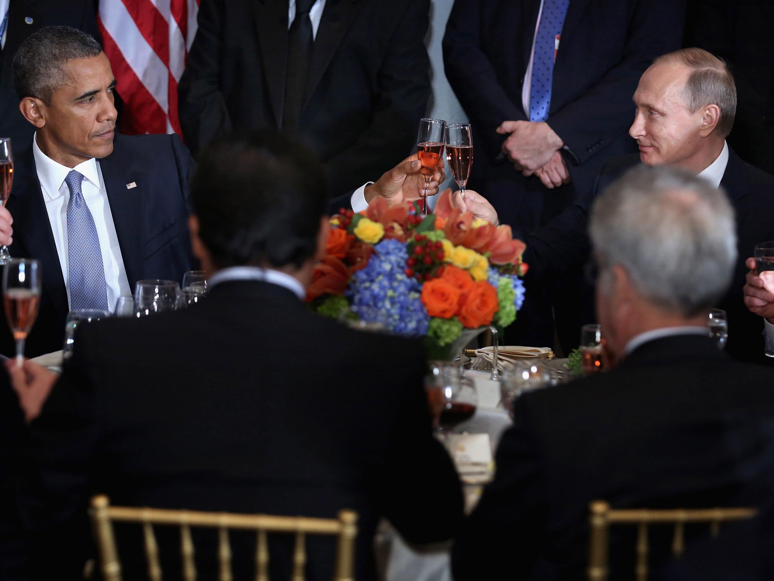 President Obama and Russian President Vladimir Putin toast during a luncheon hosted by U.N. Secretary General Ban Ki-moon during the 70th annual General Assembly of the United Nations in New York