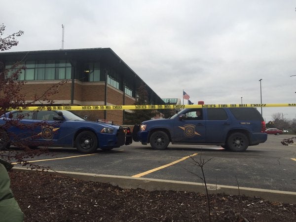 A man wielding a knife was fatally shot inside the Dearborn Police Department.