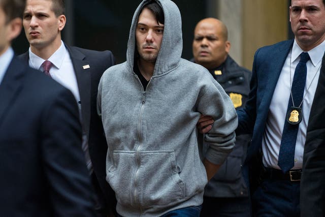 Martin Shkreli, the former hedge fund manager under fire for buying a pharmaceutical company and ratcheting up the price of a life-saving drug, is escorted by law enforcement agents in New York