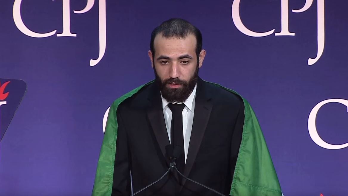 A member of Raqqa Is Being Slaughtered Silently collecting the 2015 International Press Freedom Award