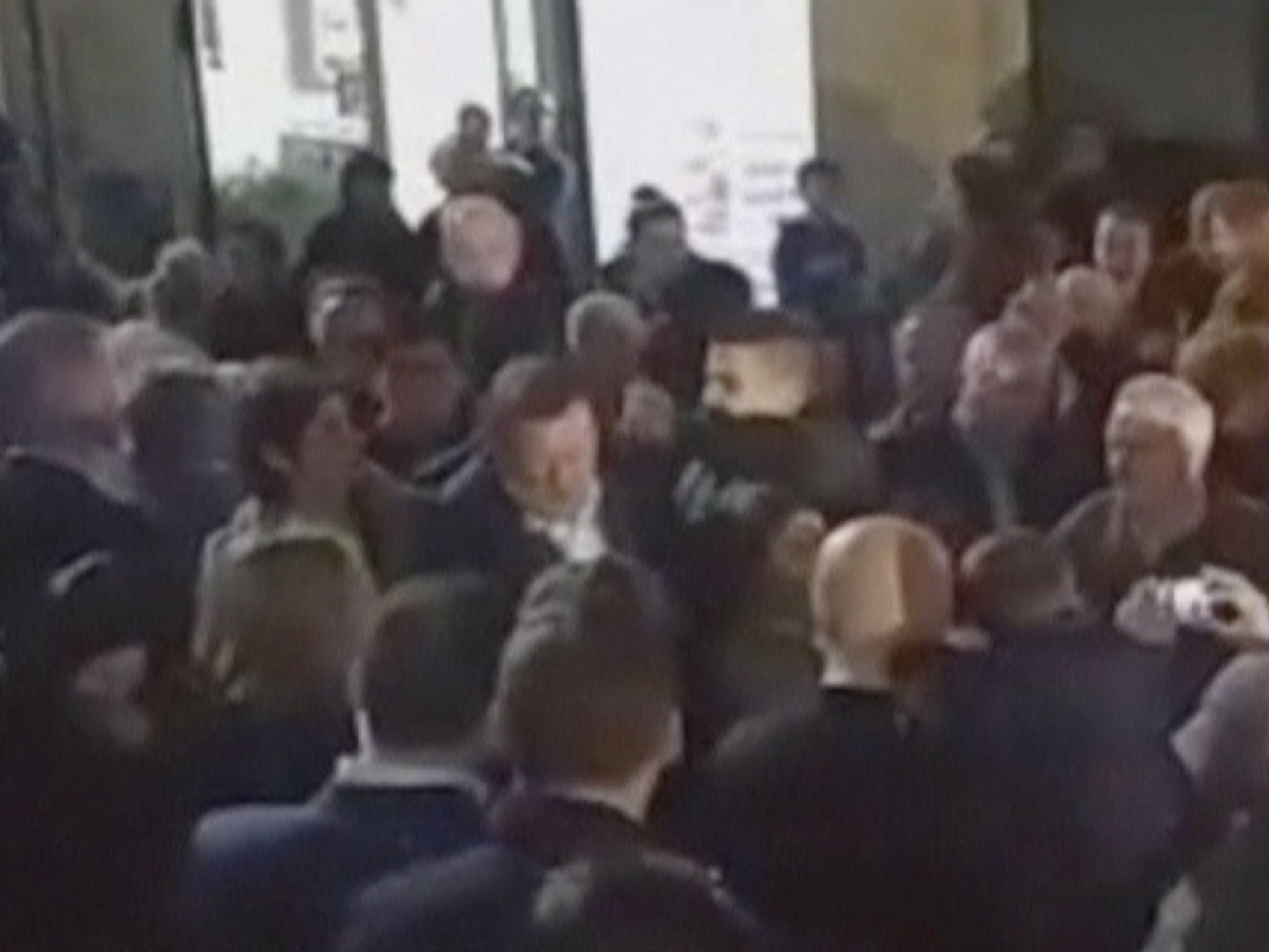 Spanish Prime Minister Mariano Rajoy is punched during a campaign event