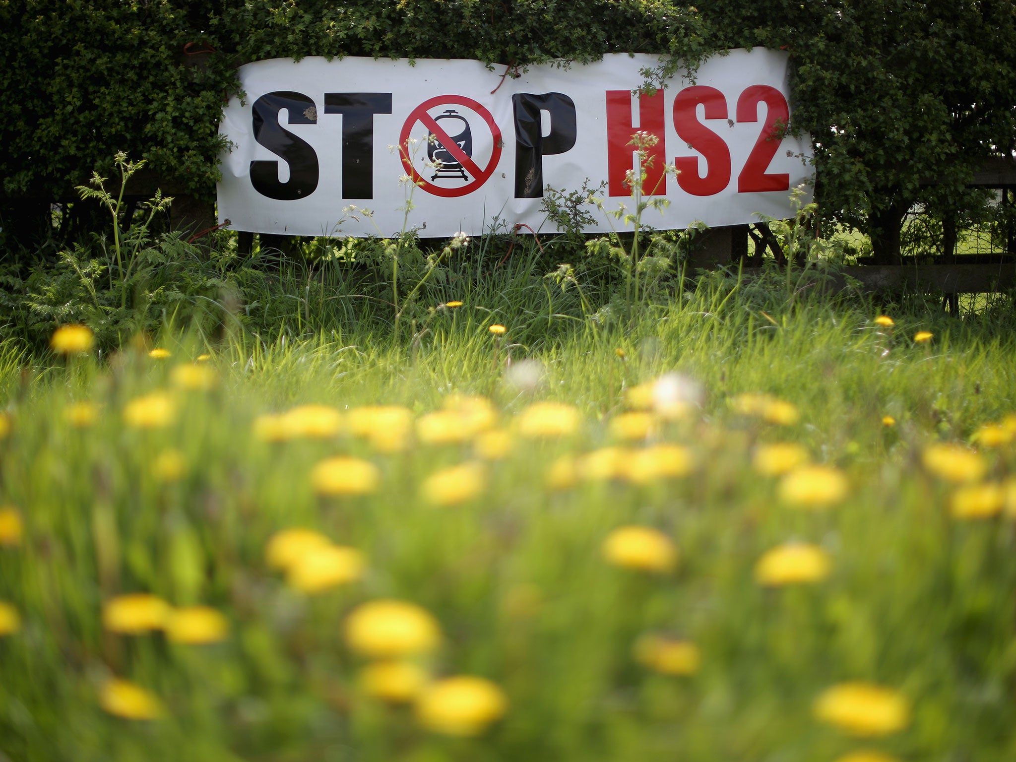 Stop HS2 posters mark the point where the proposed route of the new HS2 high speed rail link will pass through near to the village of Warburton