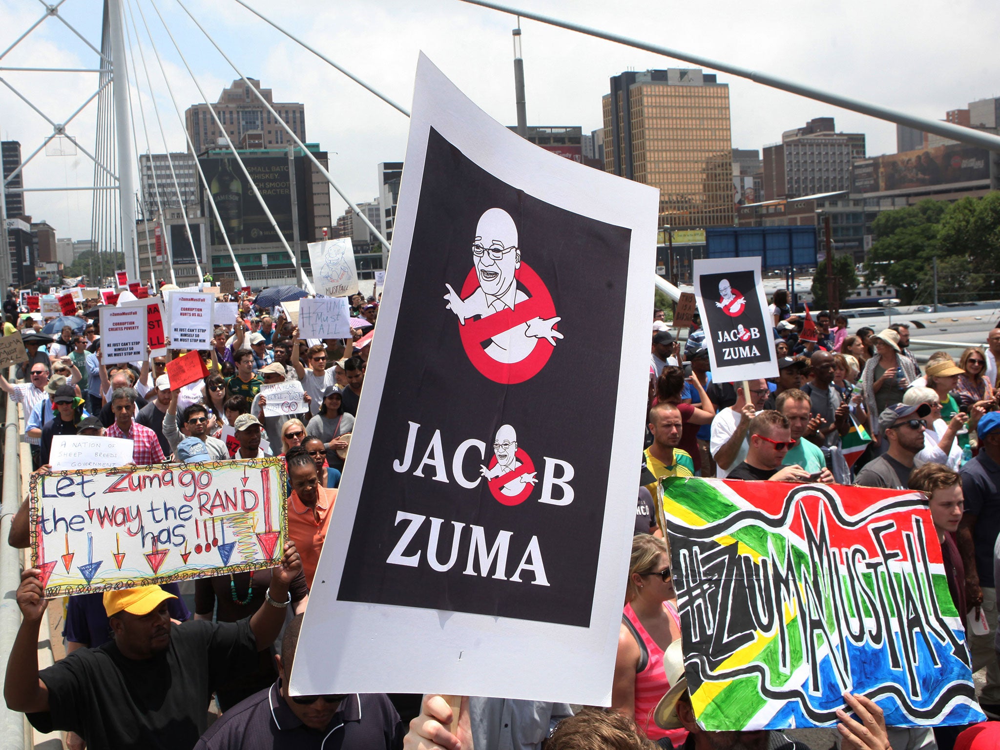 A protest march across the Nelson Mandela bridge into Johannesburg demanding that the President step down amid allegations of corruption and financial mismanagement