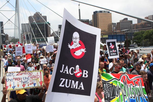A protest march across the Nelson Mandela bridge into Johannesburg demanding that the President step down amid allegations of corruption and financial mismanagement