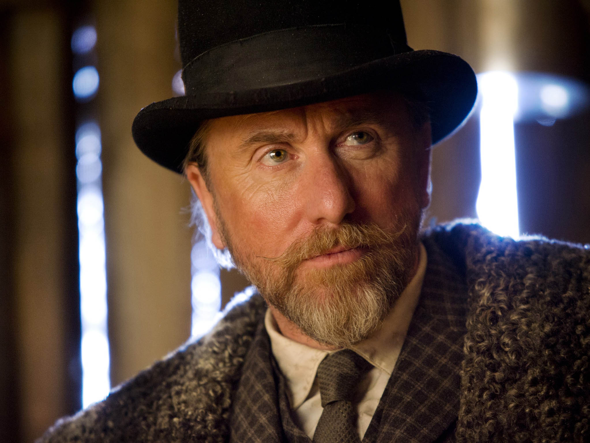 Tim Roth looks as if he is on leave from a Lucky Luke comic book as the dapper, well-spoken Englishman