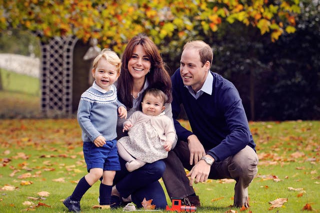 Prince William, Duke of Cambridge and Catherine, Duchess of Cambridge with their children, Prince George and Princess Charlotte, in a photograph taken late October at Kensington Palace