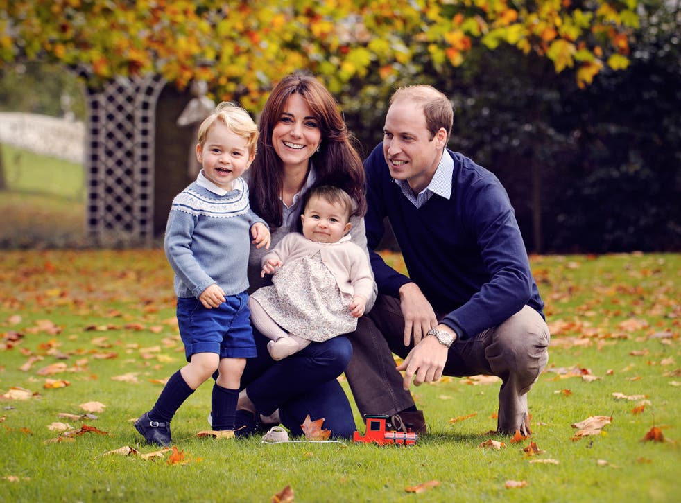 Prince William, Duke of Cambridge and Catherine, Duchess of Cambridge with their children, Prince George and Princess Charlotte, in a photograph taken late October at Kensington Palace