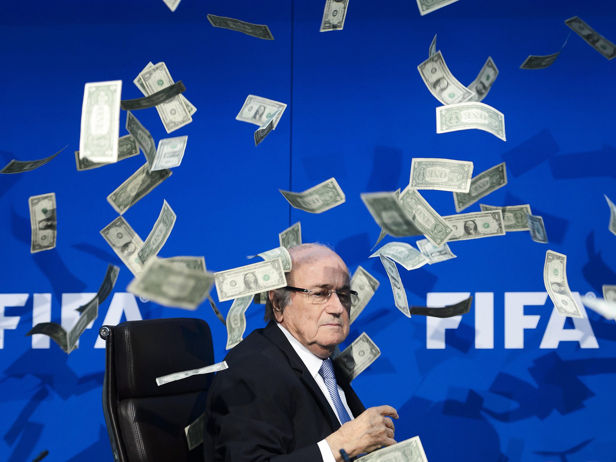 FIFA president Sepp Blatter showered with fake notes by comedian Simon Brodkin