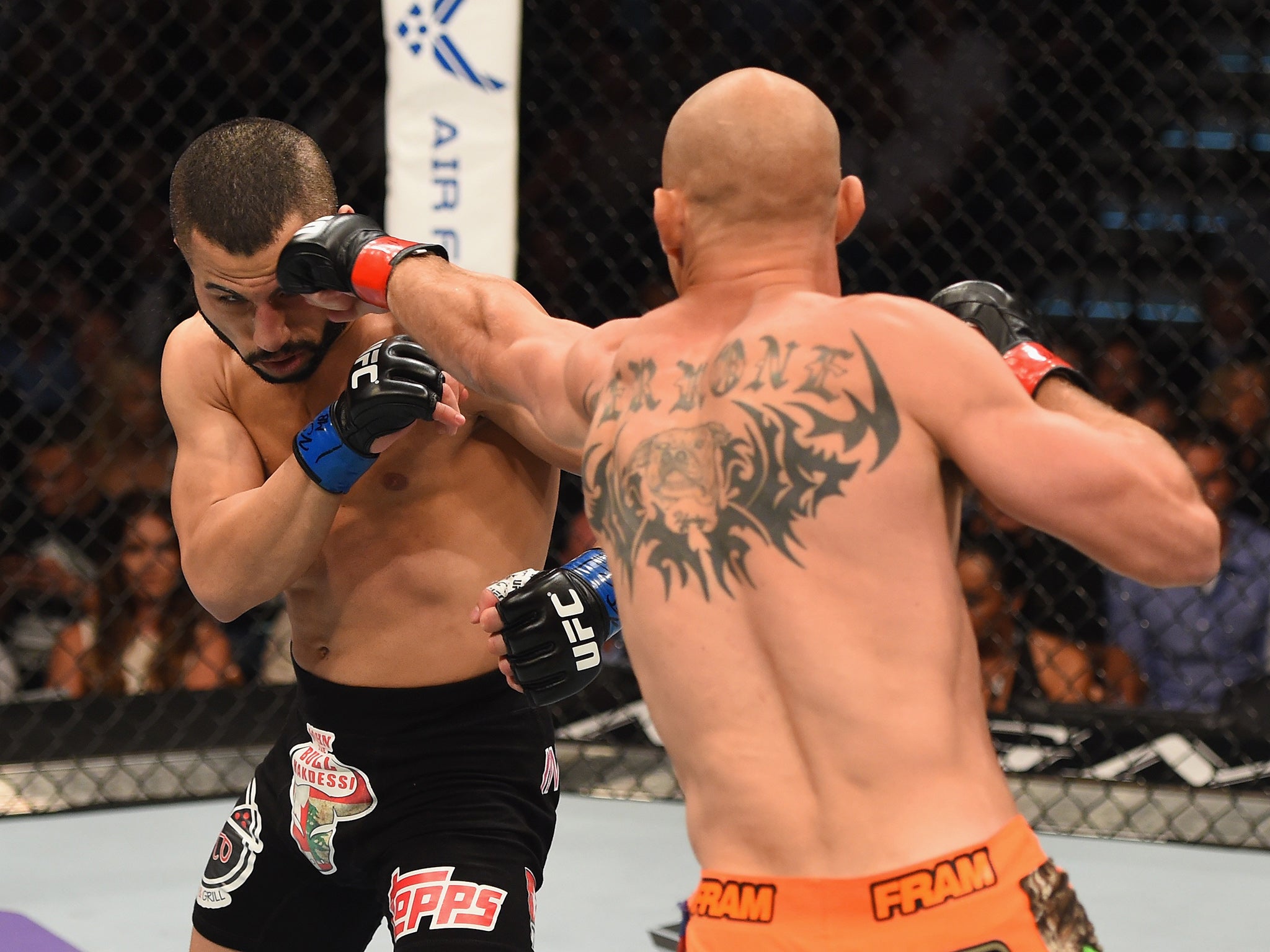 &#13;
Donald Cerrone punches John Makdessi&#13;