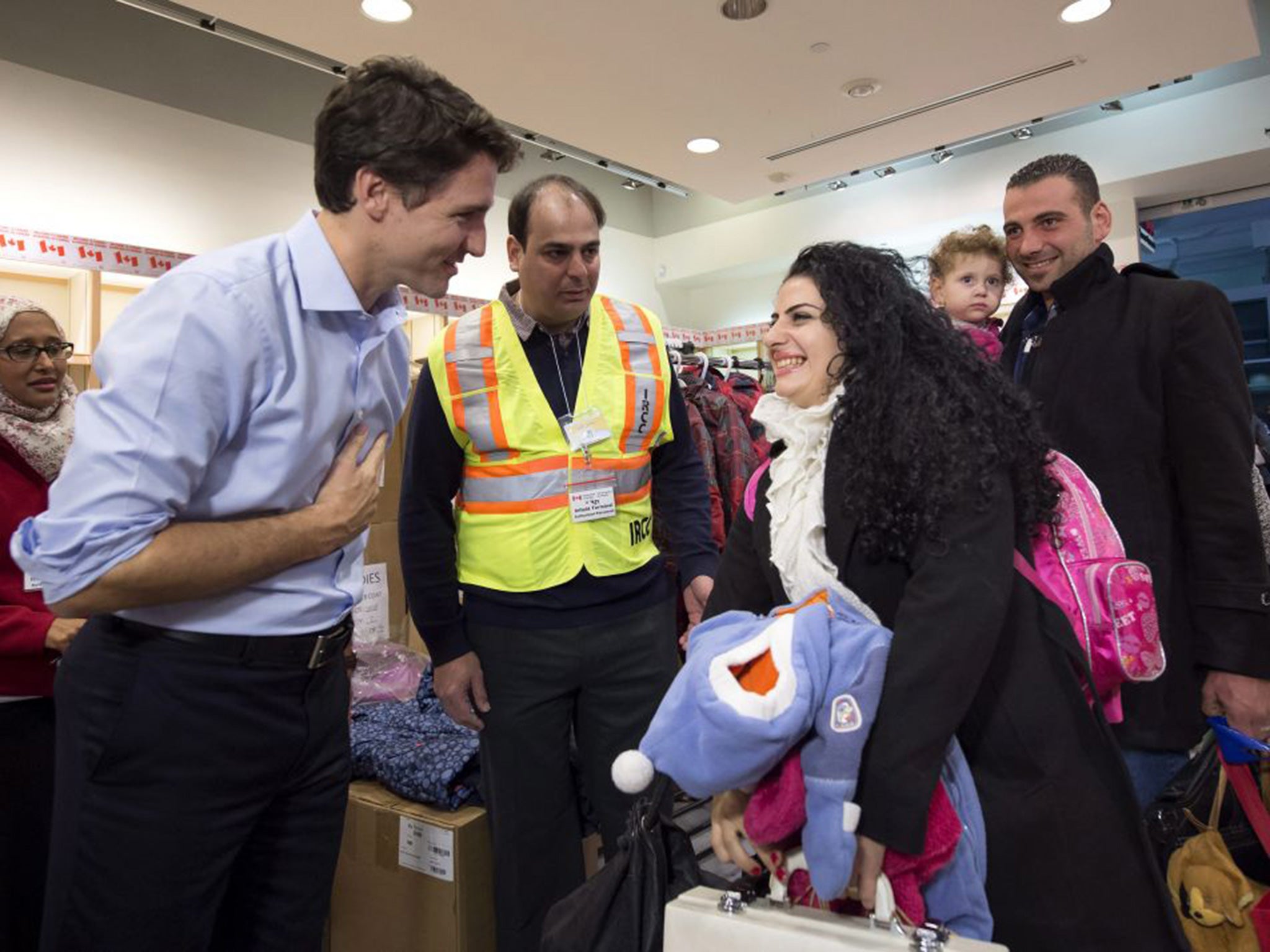 Justin Trudeau greets Syrian refugees arriving in Toronto