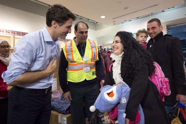 Justin Trudeau with Syrian refugees in Toronto in December
