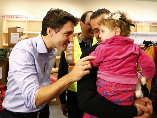 Justin Trudeau greets Syrian refugee arrivals at Toronto airport last week