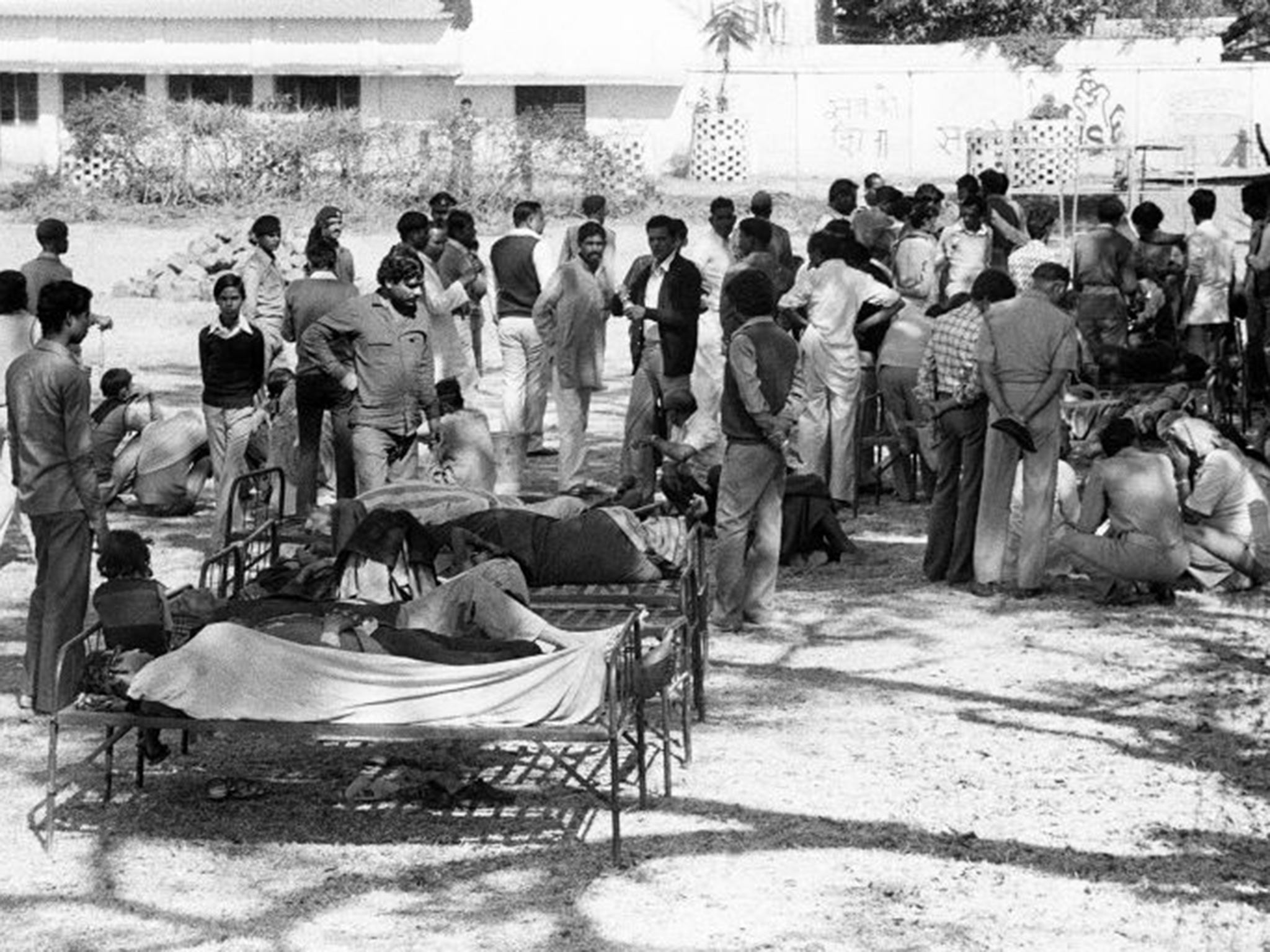 Victims of the Bhopal tragedy wait to be treated following the poison gas leak that killed around 25,000 people