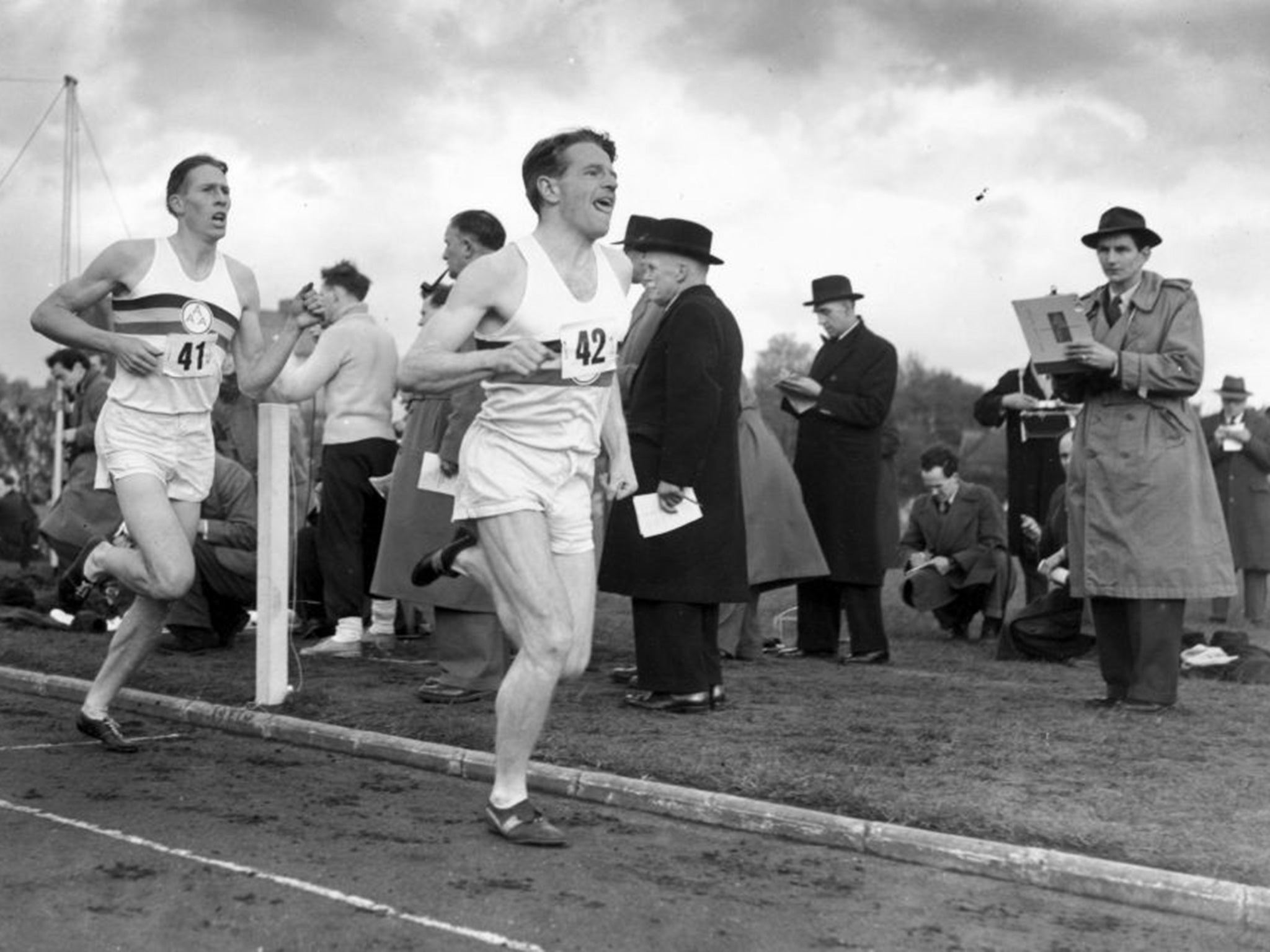 Roger Bannister (back) following pace man Chris Chataway, on the way to a new record of 3 minutes 59.4 seconds at Iffley Road, Oxford