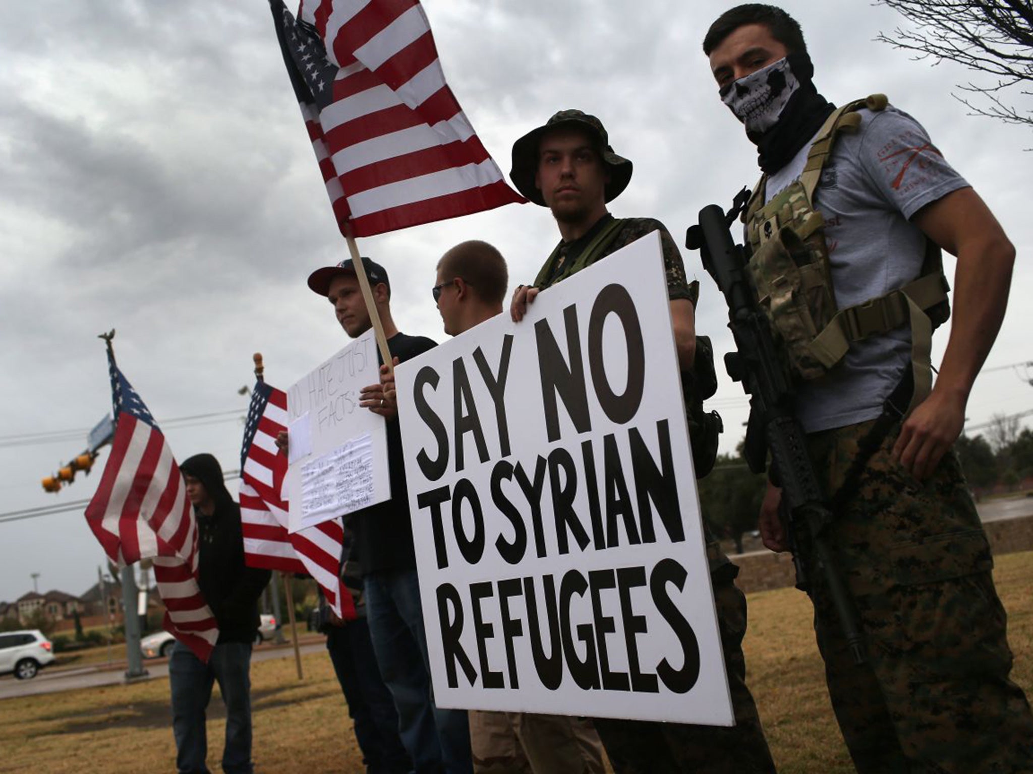 Armed protesters from the so-called Bureau of American-Islamic Relations (BAIR), take part in a demonstration in front of a mosque on December 12, 2015 in Texas