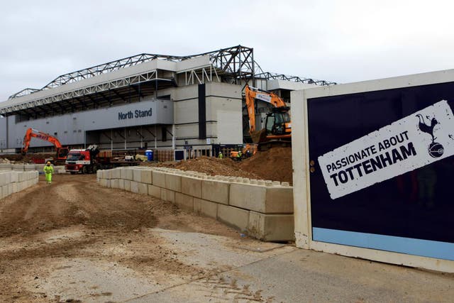 Builders work on the preparations for the new 61,00-capacity White Hart Lane, which Tottenham hope to open in 2018