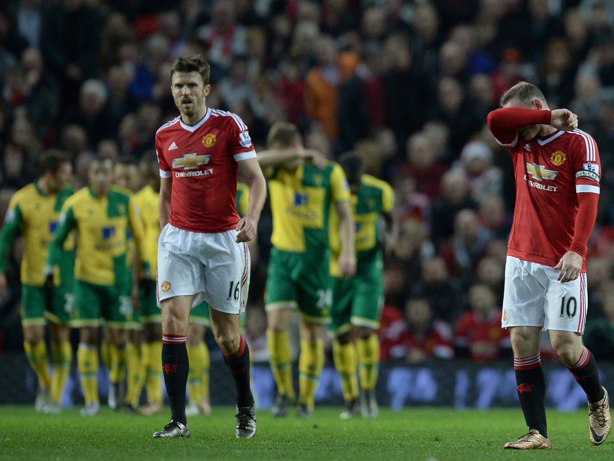 Wayne Rooney and Michael Carrick appear dejected after conceding a goal to Norwich
