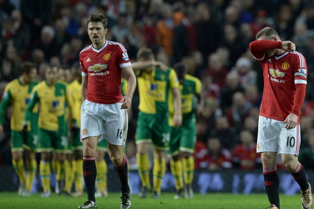 Wayne Rooney and Michael Carrick appear dejected after conceding a goal to Norwich