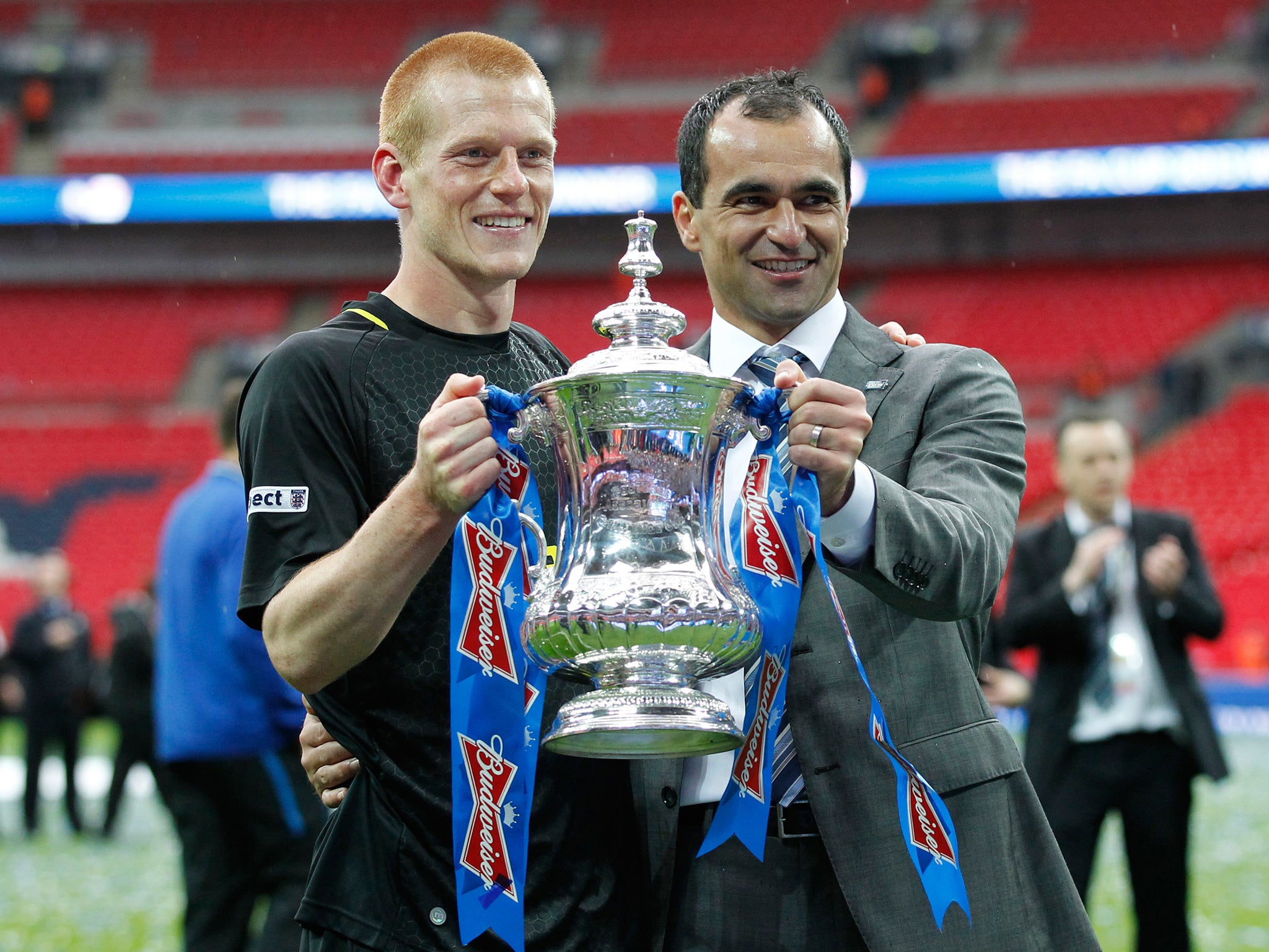 Watson celebrates Wigan's FA Cup victory with Roberto Martinez