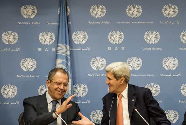 Sergei Lavrov of Russia and John Kerry of the US shake hands