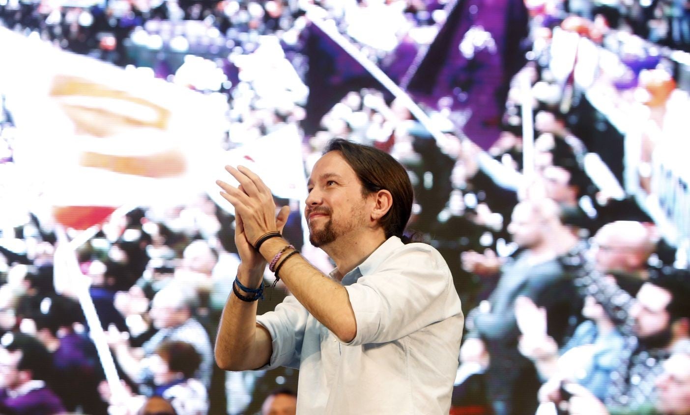 Pablo Iglesias, leader of Podemos party, applauds during a closing campaign rally in Valencia, Spain