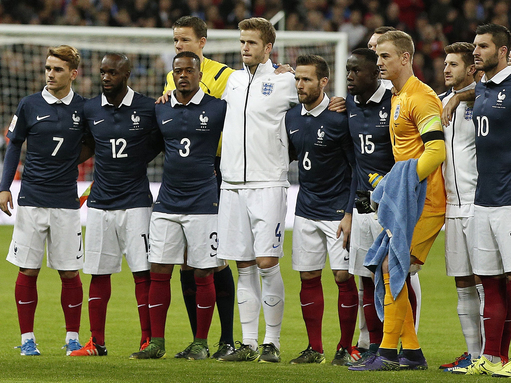 England and France players stand shoulder to shoulder at Wembley