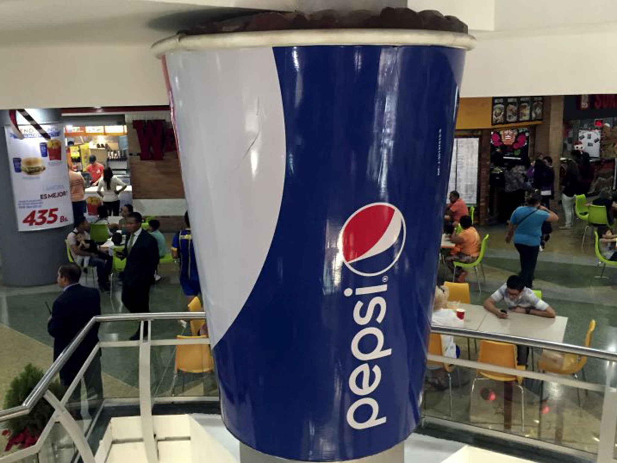 A mock giant cup of Pepsi at a shopping mall in the Venezuelan capital of Caracas on 20 December 2015