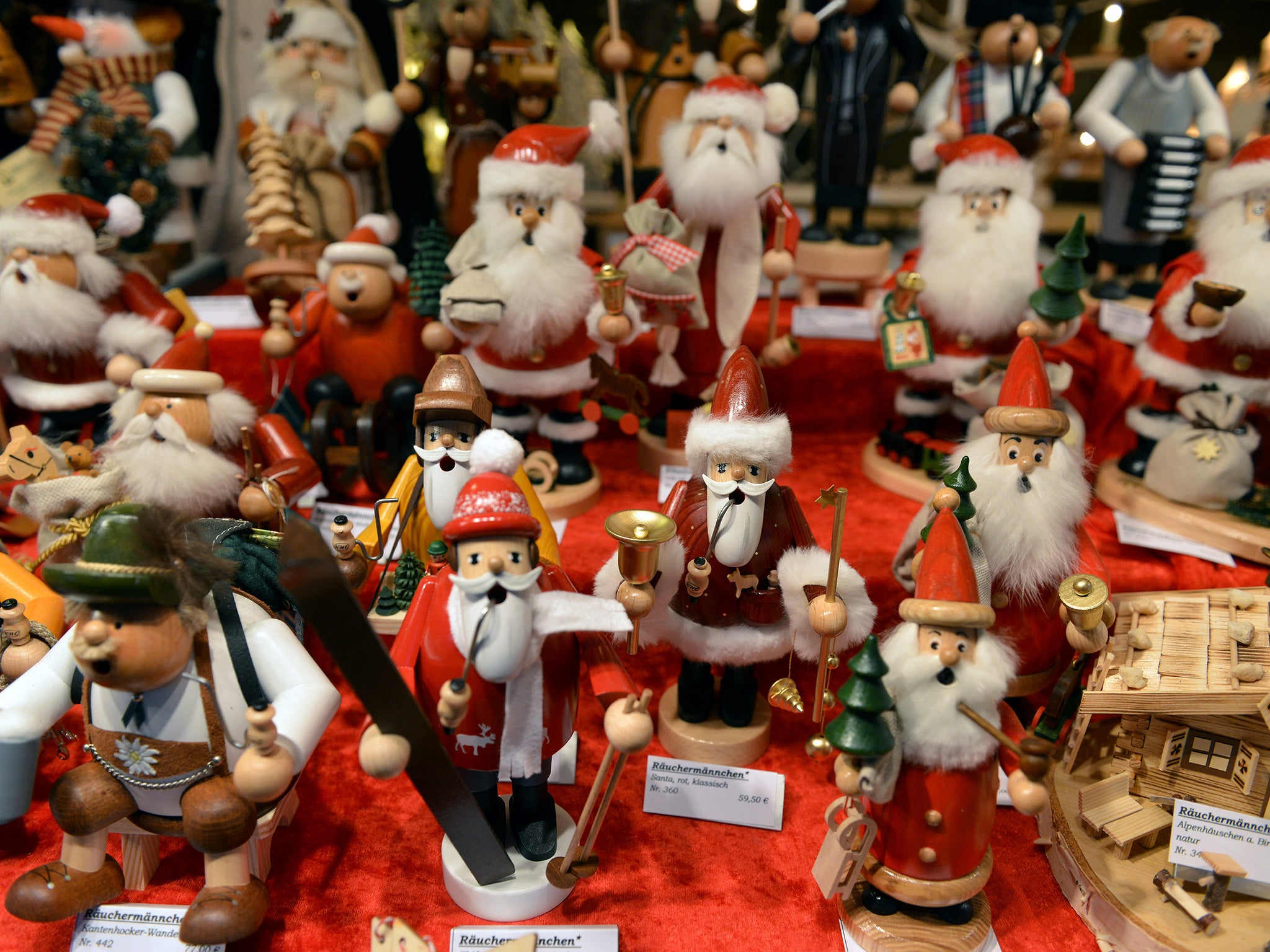Santa Claus wooden figurines on sale at Frankfurt Christmas market