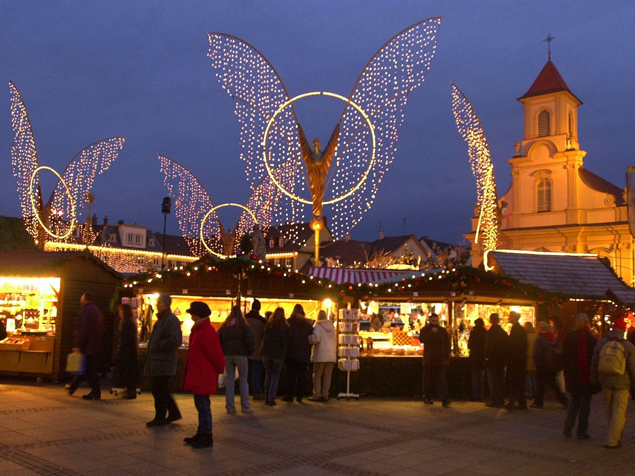 Revellers wander through the bright lights of Stuttgart's Christmas market