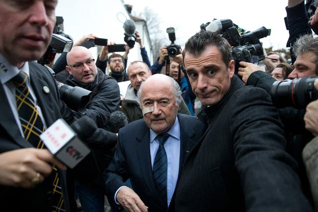 Fifa president Sepp Blatter arrives for a press conference after being banned from football for eight years