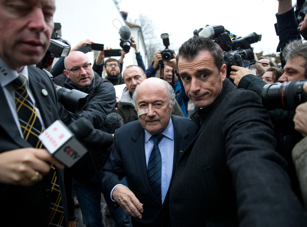 Fifa president Sepp Blatter arrives for a press conference after being banned from football for eight years
