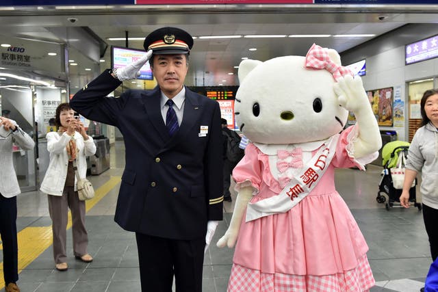 Hello Kitty accepts the honour of being named one-day stationmaster of the Keio Tama-Center Station in west Tokyo in 2014