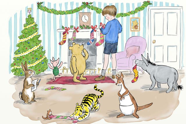 Pooh looks at Christopher Robin as he pins the stockings to the fireplace.