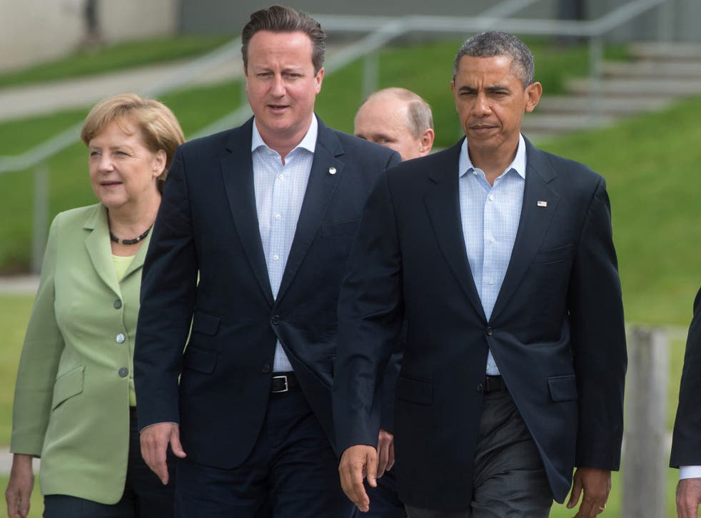 David Cameron, centre, only ranks below Angela Merkel, left, and Barack Obama, right, in popularity