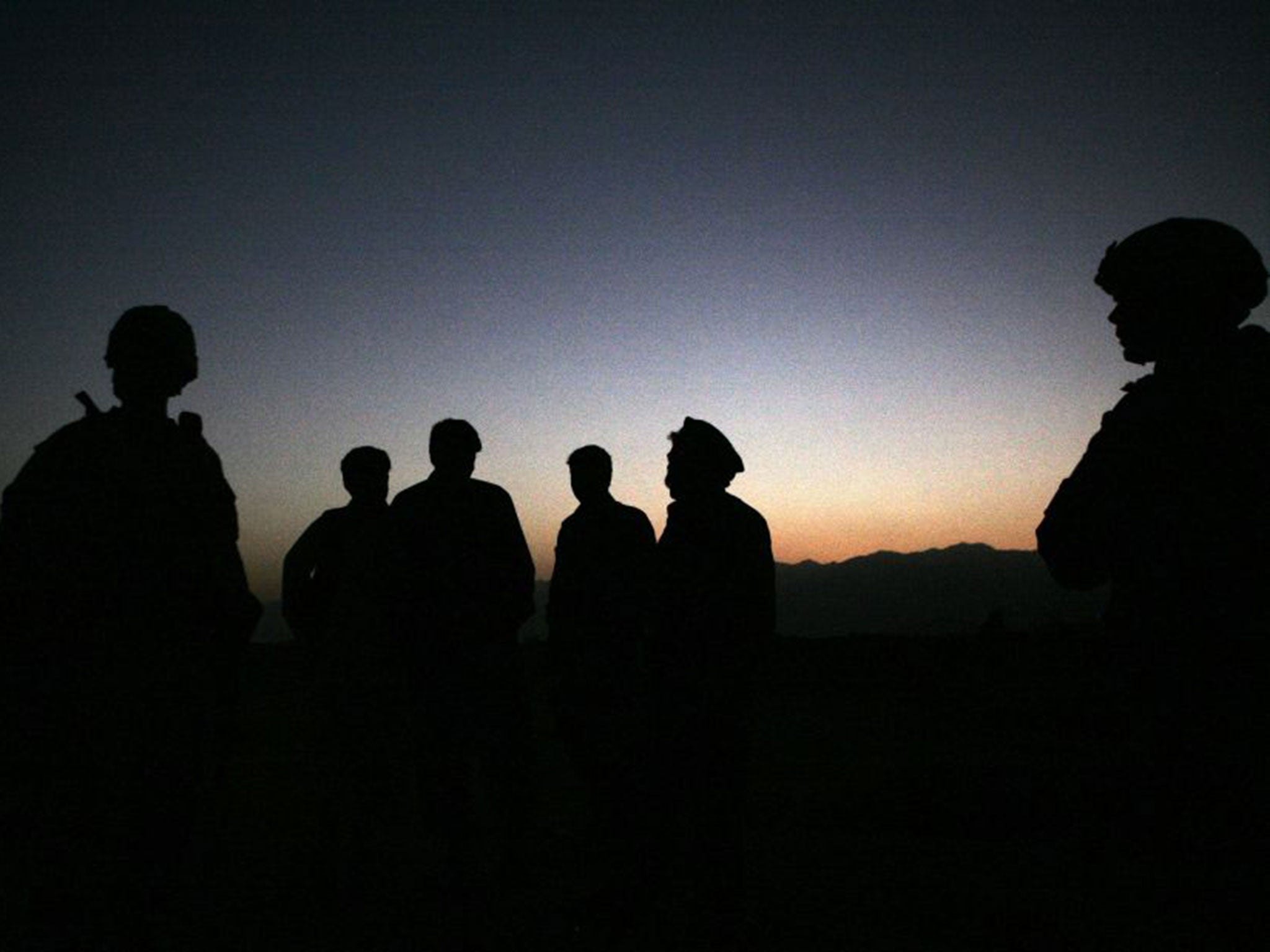 US troops join Afghan police on a joint patrol outside Bagram airfield. The Taliban killed six US soldiers there yesterday