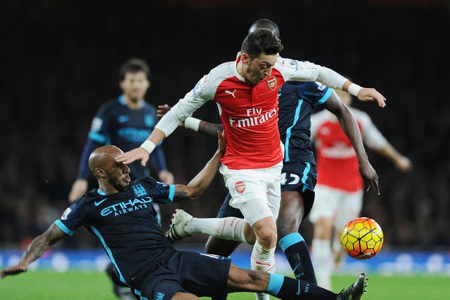 Mesut Ozil in action for Arsenal against Manchester City
