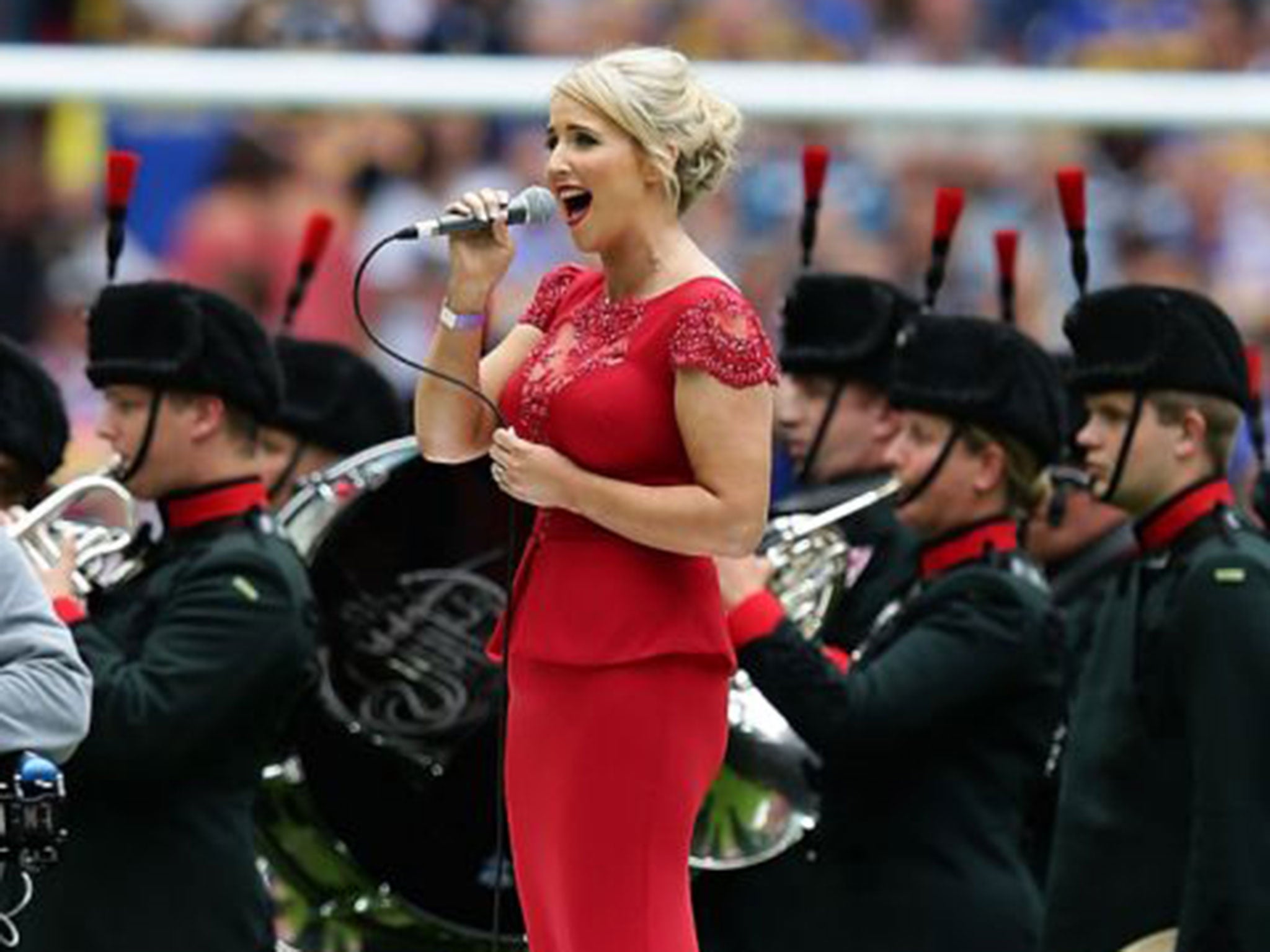 Lizzie Jones singing at the Challenge Cup final