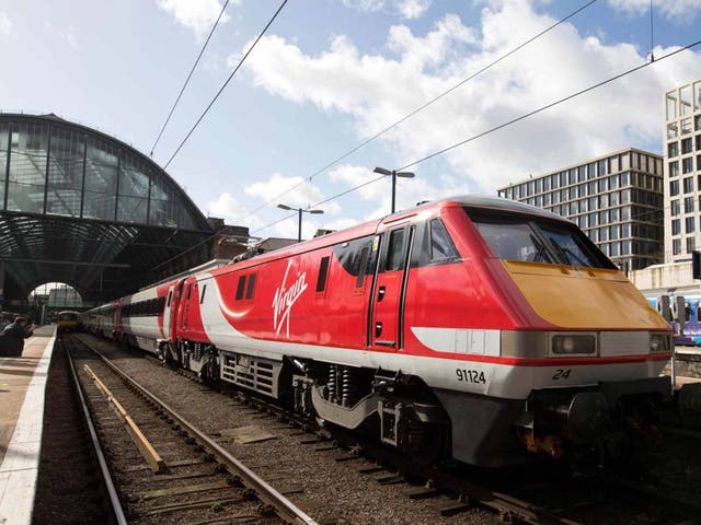 Branson flyer: the first Virgin East Coast train arrives at King's Cross