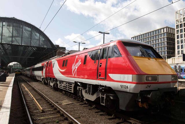 Branson flyer: the first Virgin East Coast train arrives at King's Cross